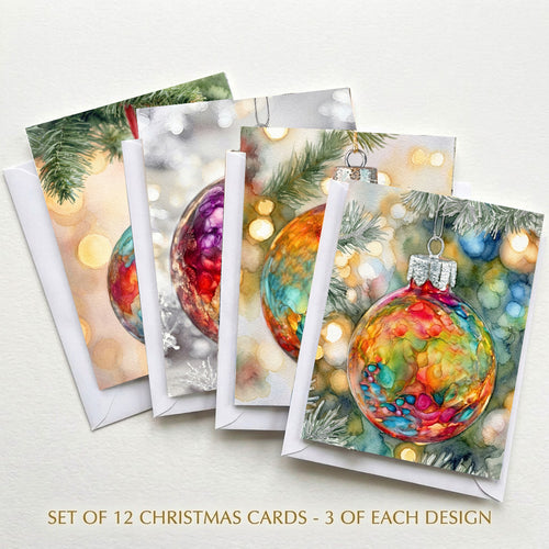 Set of 12 colorful Christmas ornament cards with four alcohol ink-style designs and white envelopes
