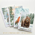 Set of 12 winter wildlife Christmas cards with moose, rabbit, fox, and bear designs and white envelopes
